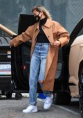 Hailey Bieber looks stylish in a tan long coat as she arrives at a studio in Studio City, California