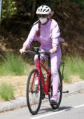 Isla Fisher looking cute in all-lavender during her daily bike ride in Los Angeles