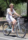 Karlie Kloss enjoys a bike ride with husband Joshua Kushner in Santa Monica, California