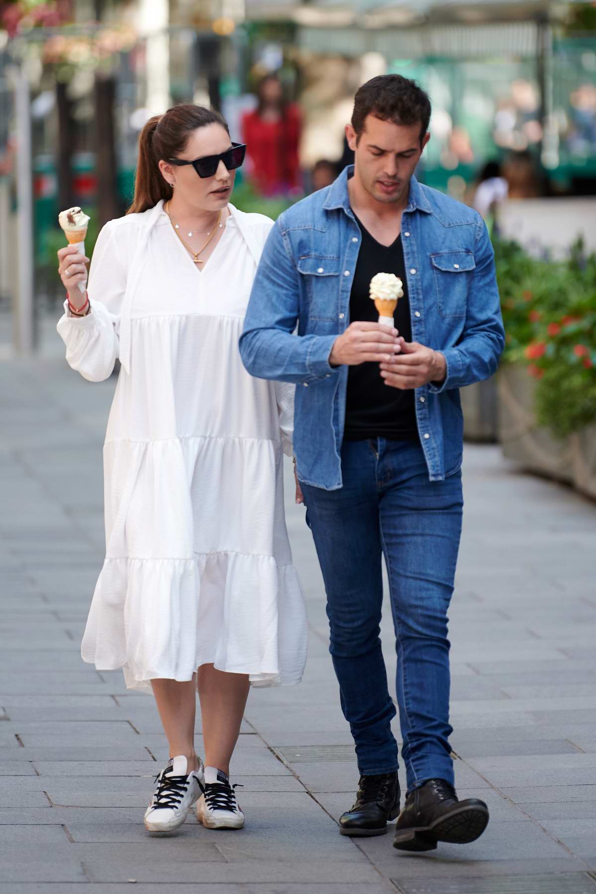 Kelly Brook and Jeremy Parisi enjoy some ice cream while heading to the Global Radio studios in London, UK