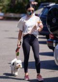 Lucy Hale sports a tie-dye tee and black leggings during a coffee run with a friend in Studio City, California
