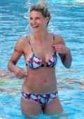 Michelle Hunziker sports a colorful bikini while relaxing by the pool in Milano Marittima, Italy