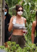 Emily Ratajkowski flaunts her toned midriff in a crop tank top while getting lunch at a local restaurant in the Hamptons, New York