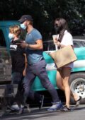 Dakota Johnson dons a white romper during a lunch outing with Chris Martin in the Hamptons, New York