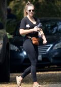 Elizabeth Olsen sports a black top and leggings as she leaves a private home gym in Los Angeles