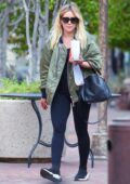 Hilary Duff sports a green bomber jacket and leggings while making a coffee run in Los Angeles