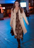 Kelly Brook is all smiles as she leaves the Global Radio wearing an animal print dress in London, UK