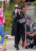 Ashley Benson dressed in all-black enjoys an alfresco lunch with a friend in Los Feliz, California