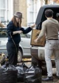 Rose Leslie shows her baby bump while Kit Harrington loads some luggage into the car in London, UK