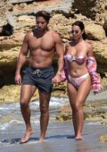 Yazmin Oukhellou looks amazing in a floral print bikini while enjoying a walk along the beach with James Lock in Cyprus