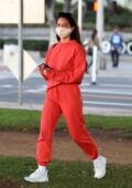 Olivia Munn sports red sweats as she picks up her friends in her Tesla before heading to Santa Monica, California