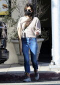 Jordana Brewster steps out on a windy day for a fresh baguette and coffee at Kreation Organic in Santa Monica, California