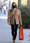 Lily Collins wears a leather jacket, denim and suede boots while out to do some shopping at Hermes in Los Angeles