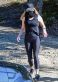 Reese Witherspoon sports black tank top and leggings during a morning hike with a friend in Los Angeles
