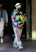 Demi Lovato wears a tie-dye hoodie with sweatpants as she leaves a building in Beverly Hills, California