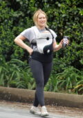 Hilary Duff straps her newborn baby to her chest while enjoying a hike with her family in Studio City, California