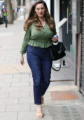 Kelly Brook looks amazing in a stylish ruffled green shirt and jeans at Heart Radio in London, UK