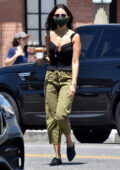 Eiza Gonzalez wears a black top and green drawstring pants while making a coffee run in West Hollywood, California