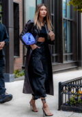 Hailey Bieber looks stylish in a leather trench coat with an all-black ensemble as she leaves her apartment in Brooklyn, New York