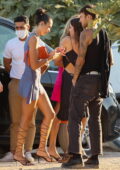 Dua Lipa shows some legs in a blue mini dress while out to dinner with friends in Ibiza, Spain