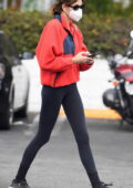 Kaia Gerber sports a red fleece and black leggings while making a coffee run at Commissary Coffee in Burbank, California