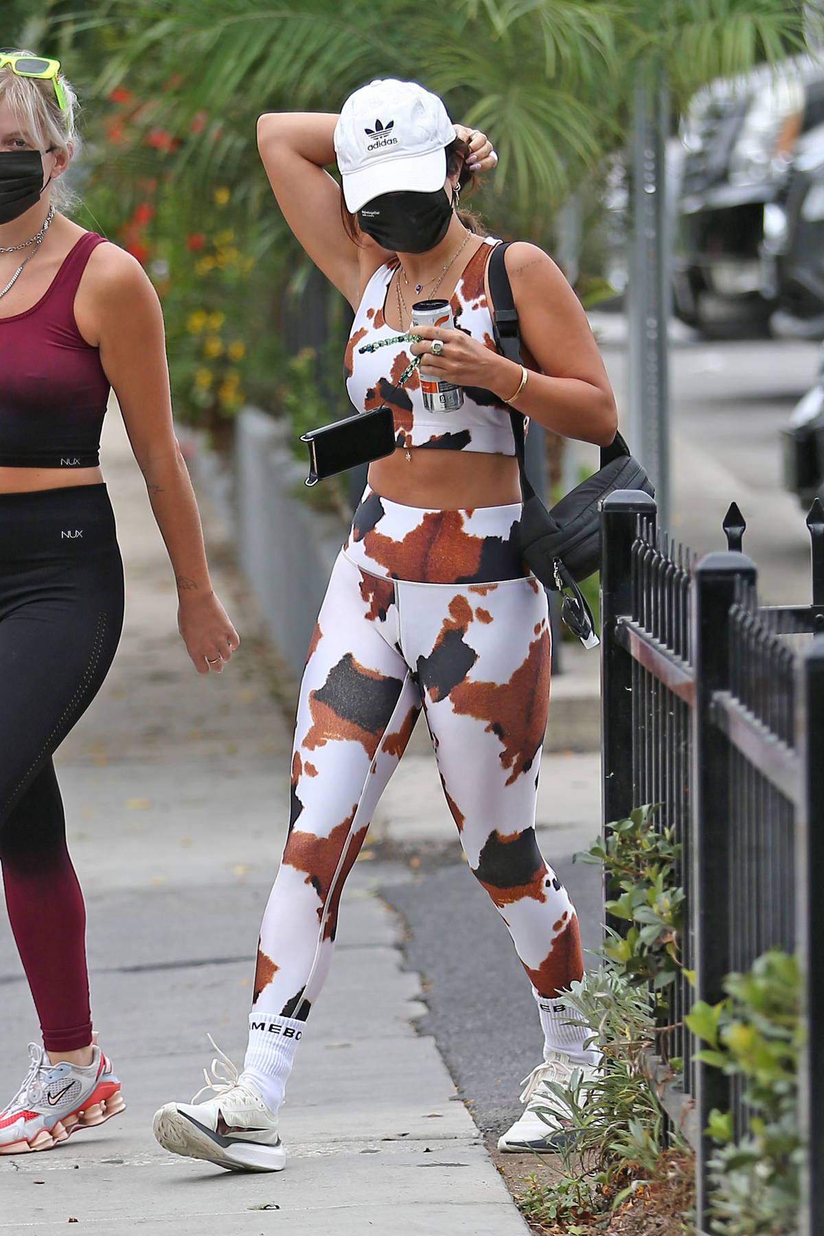 Vanessa Hudgens sports cow-print crop top and leggings as she hits