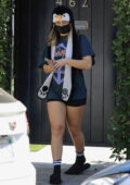 Addison Rae rocks tiny black shorts with a vintage tee and penguin hat while leaving her Pilates class in West Hollywood, California