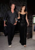 Kaia Gerber looks stunning in a black dress as heads out of the Crosby hotel with her dad Rande Gerber in New York City