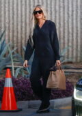 Khloe Kardashian seen wearing a cozy jumpsuit as she her annual family Christmas photoshoot in Calabasas, California