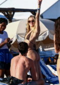 Rachel Hilbert stuns in a bikini as she enjoys a beach day with friends during Art Basel in Miami Beach, Florida