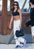 Thylane Blondeau displays her flat abs in a crop top as she leaves the beach with boyfriend Benjamin Attal in Miami, Florida