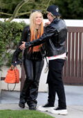 Avril Lavigne and Mod Sun share a hug before heading out together in West Hollywood, California