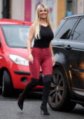 Christine McGuinness gets leggy in red leggings with thigh-high boots while out to lunch in Alderley Edge, Cheshire, UK