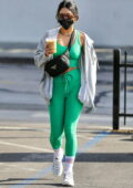 Vanessa Hudgens grabs an iced-coffee while leaving the gym wearing mint green crop top and leggings in West Hollywood, California
