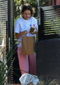 Lily James spotted as she gets some food delivered to her home in Los Angeles