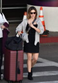 Lucy Hale looks cute in a black denim dress while arriving for a flight out of LAX airport in Los Angeles