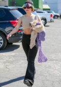 Addison Rae wears a knitted hat, cropped tee and flared joggers as she leaves a Pilates class in West Hollywood, California