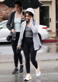 Lucy Hale braves the rain in a hoodie, tank top and leggings while leaving a workout in Studio City, California