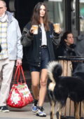 Emily Ratajkowski sports legging shorts with a jacket during a coffee run with her son and husband in New York City