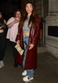 Madison Beer is all smiles while stepping out wearing a red trench coat in London, UK