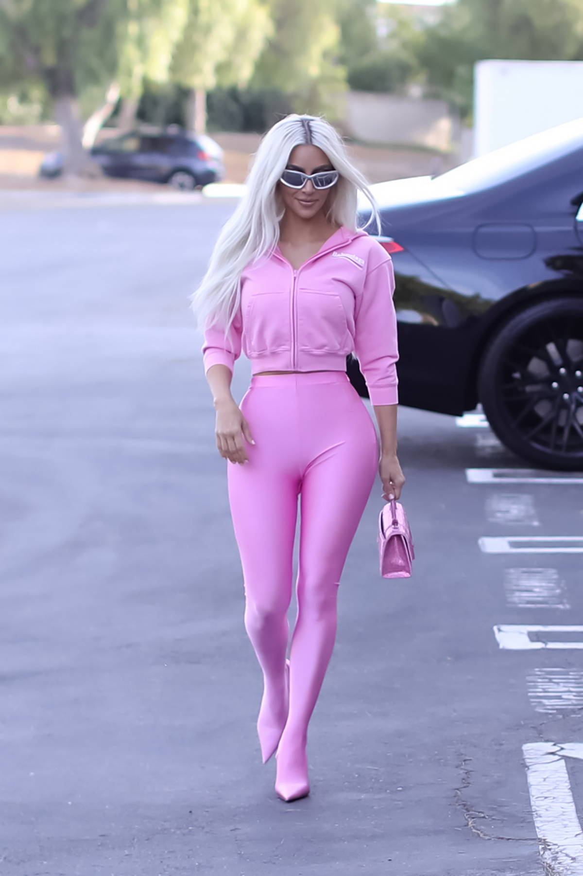 Kim Kardashian stuns in pink as she leaves a SKIMS photoshoot and