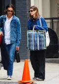 Kaia Gerber keeps it casual in a denim shirt and black pants during a shopping trip with a friend in New York City