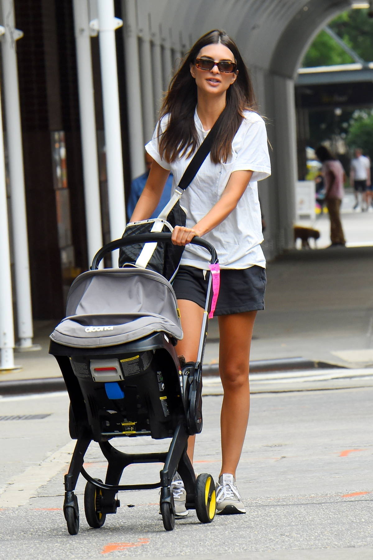 Emily Ratajkowski opts for a casual look in shorts and tee while out on