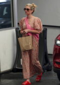 Emma Roberts wears a floral print summer dress while out running errands in Los Angeles