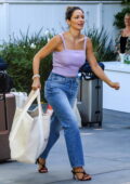 Katharine McPhee dons a lavender crop top and jeans as she arrives at the Day of Indulgence party in Brentwood, California