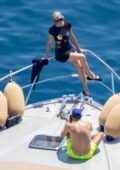 Paris Hilton poses on yacht in a black mini dress while enjoying her vacation with husband Carter Reum in Positano, Italy