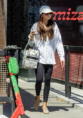 Sarah Hyland wears a 'Wifey' hat with an oversized shirt and leggings as she leaves a salon in Los Angeles