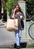 Ashley Tisdale takes a call while picking up her take-out lunch at All Time in Los Angeles