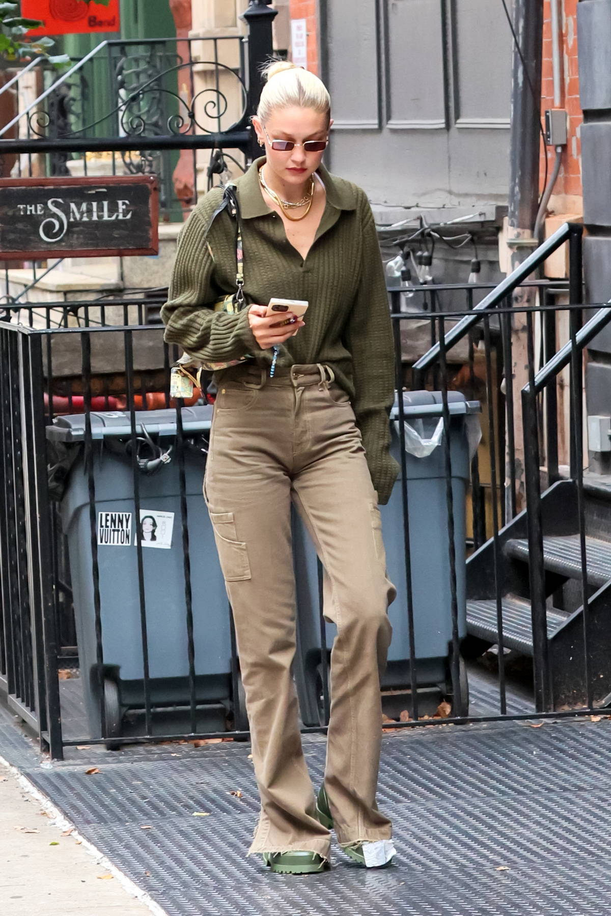 gigi hadid dons an army green sweater and cargo pants while out on a solo  stroll in new york city-070922_1