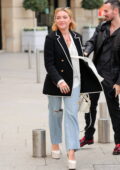Florence Pugh keeps it stylish in a black blazer with ripped jeans while out during Paris Fashion Week in Paris, France